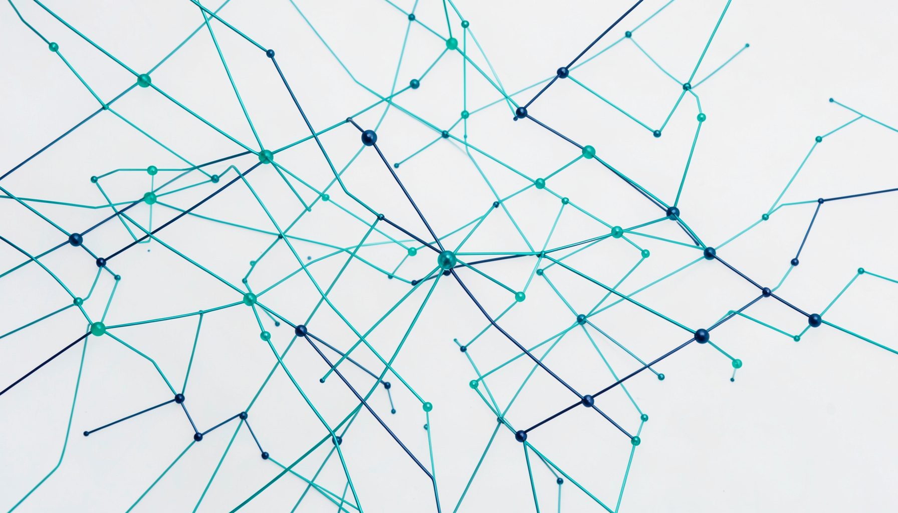 A clean, abstract composition of interconnected nodes and lines in teal and navy against a light background, suggesting digital infrastructure planning.